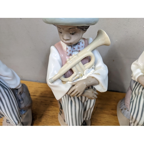 269 - Lladro porcelain musicians comprising boys playing a cello, saxophone, trumpet and clarinet
Location... 