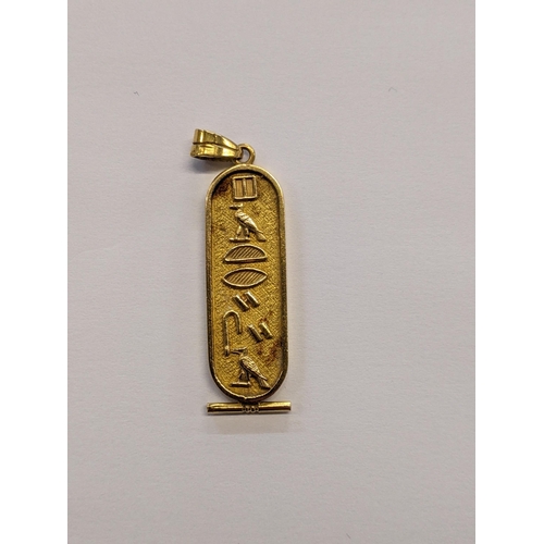 29 - A Egyptian gold pendant decorated with hieroglyphics, tested as 14ct, 8.3g
Location: CAB5