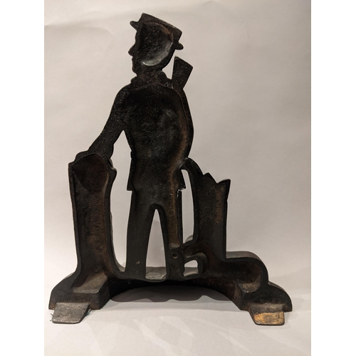 90 - An Edwardian painted and gilt, cast iron door stop in the form of a hunter with a gun, a dog at his ... 