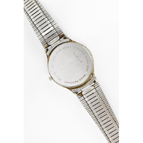 74 - A Bulova quartz, gents stainless steel wristwatch, circa 1979 having a silvered dial with centre sec... 