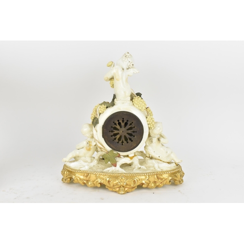 87 - A late 19th century porcelain mantle clock, decorated with cherubs eating grapes on a gilded base, t... 