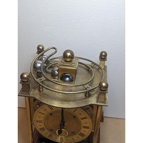 91 - A late 20th century Harding & Bazeley Spherical weight clock, limited edition no.444, the gilt metal... 