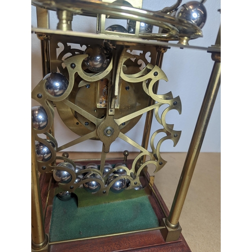 91 - A late 20th century Harding & Bazeley Spherical weight clock, limited edition no.444, the gilt metal... 