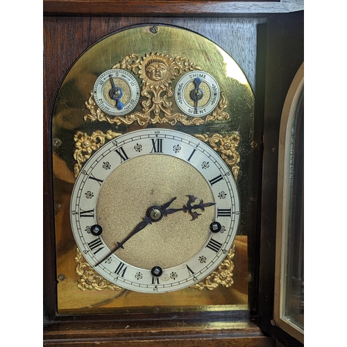 93 - An early 20th century directors style clock by Winterhalder & Hofmeier, the arched top mahogany case... 