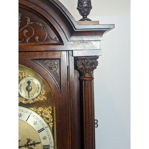 93 - An early 20th century directors style clock by Winterhalder & Hofmeier, the arched top mahogany case... 