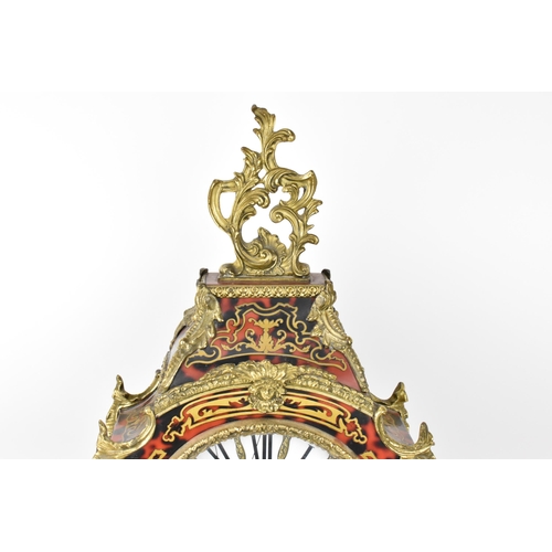 75 - A 20th century French boulle work mantle clock having applied gilt metal C scroll and floral mounts ... 