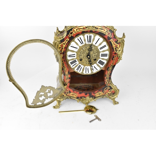 75 - A 20th century French boulle work mantle clock having applied gilt metal C scroll and floral mounts ... 