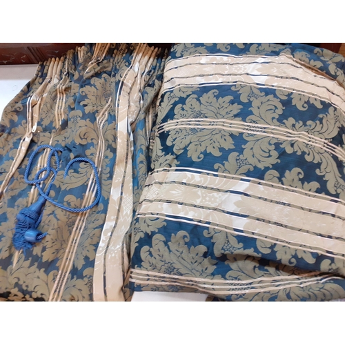 122 - A pair of blue and cream curtains with gathered heading, each curtain measuring 100cm w x 116cm drop... 