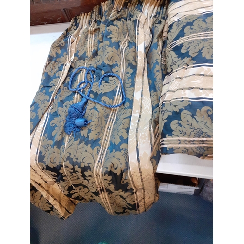 122 - A pair of blue and cream curtains with gathered heading, each curtain measuring 100cm w x 116cm drop... 