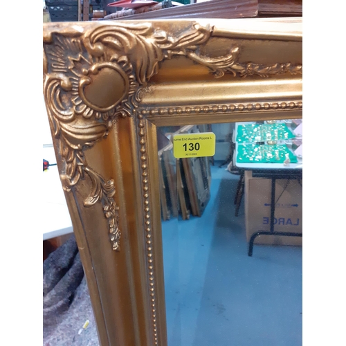 130 - A modern gold framed mirror, 119cm x 89cm 
Location: LAM