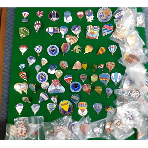 332 - A case containing a large collection of metal and enamelled hot air balloon badges, 1970's, 80's and... 