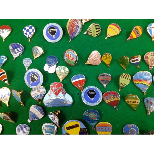 332 - A case containing a large collection of metal and enamelled hot air balloon badges, 1970's, 80's and... 