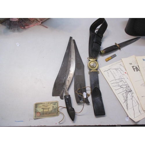 250 - A mixed lot to include a WWII British fighting knife, Philippines dagger 'bolo knife', a WWII era Ja... 