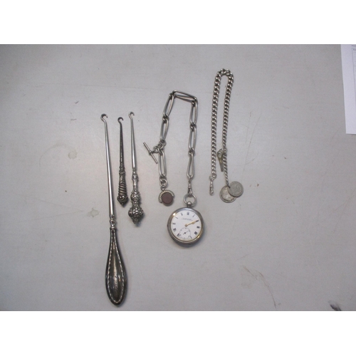 257 - A silver cased pocket watch, two silver pocket watch chains and three silver handled button hooks
Lo... 