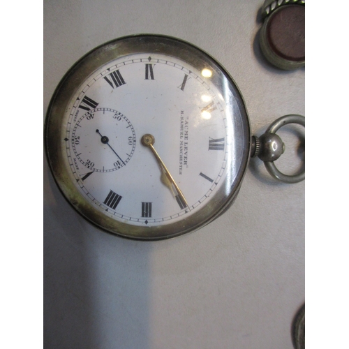 257 - A silver cased pocket watch, two silver pocket watch chains and three silver handled button hooks
Lo... 