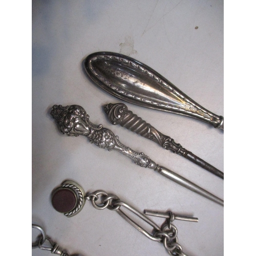 257 - A silver cased pocket watch, two silver pocket watch chains and three silver handled button hooks
Lo... 