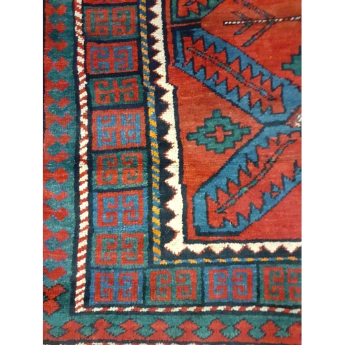 399 - A red ground Kelim rug with navy geometrical patterns, 240cm x 160cm
Location: RAM