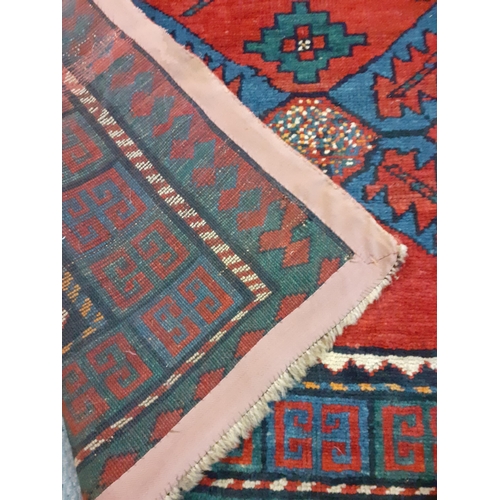 399 - A red ground Kelim rug with navy geometrical patterns, 240cm x 160cm
Location: RAM