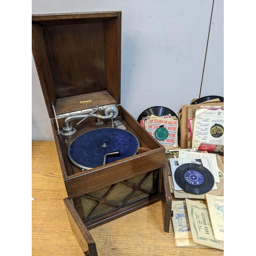 374 - A Linguaphone oak cased table top gramophone with records, solophone, cigarette cards and drawing se... 