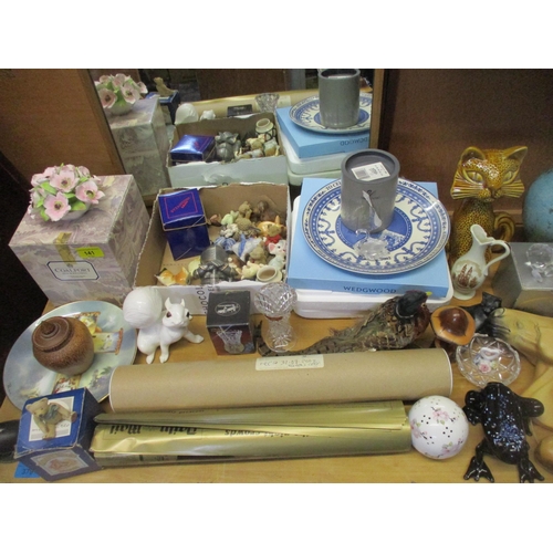 141 - A mixed lot of various ornaments to include a boxed Poole vase, Portmeirion coasters, Swarovski crys... 