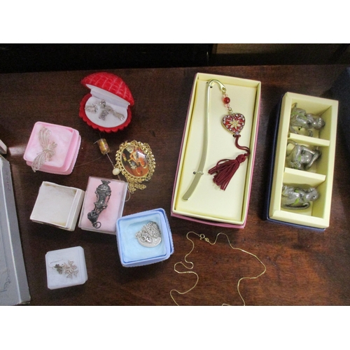 142 - A selection of jewellery, silver plated photo frames, and other items to include a 9ct gold necklace... 