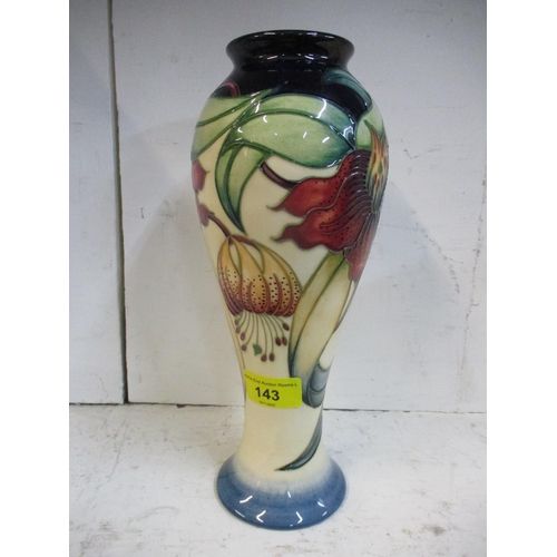 143 - A Moorcroft pottery Anna Lily pattern inverted baluster vase, designed by Nicola Slaney, date cypher... 