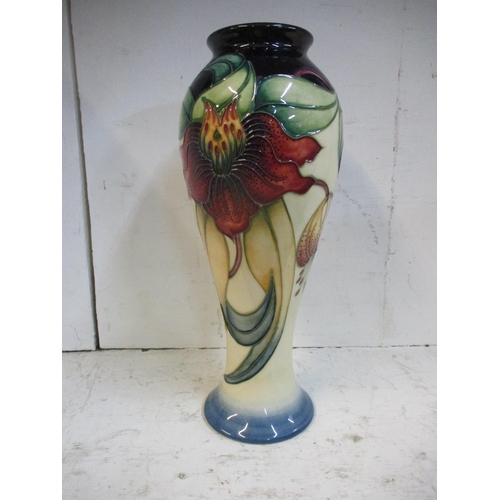 143 - A Moorcroft pottery Anna Lily pattern inverted baluster vase, designed by Nicola Slaney, date cypher... 