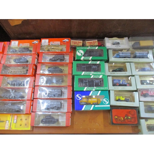 148 - A lot of boxed HO model railway miniatures and accessories to include model vehicles to include Roco... 