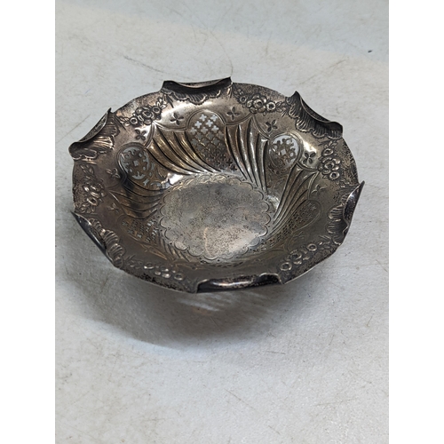 173 - A late 19th century silver dish having pierced and embossed decoration, hallmarked Birmingham 1893, ... 