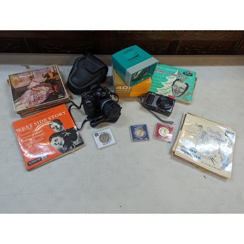 179 - A mixed lot to include a Lumix Panasonic DC-TZ90, a Fujifilm Fine Pix and 401 Photax, commemorative ... 