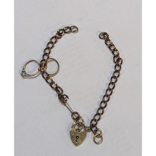 180 - A 9ct gold padlock clasp bracelet A/F with attached 9ct gold ring charm, one inset with white sapphi... 