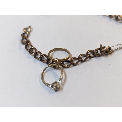 180 - A 9ct gold padlock clasp bracelet A/F with attached 9ct gold ring charm, one inset with white sapphi... 