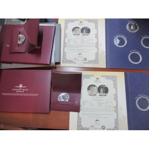 152 - A collection of Royal and London Mint commemorative £5 and other coins, in original packaging, some ... 