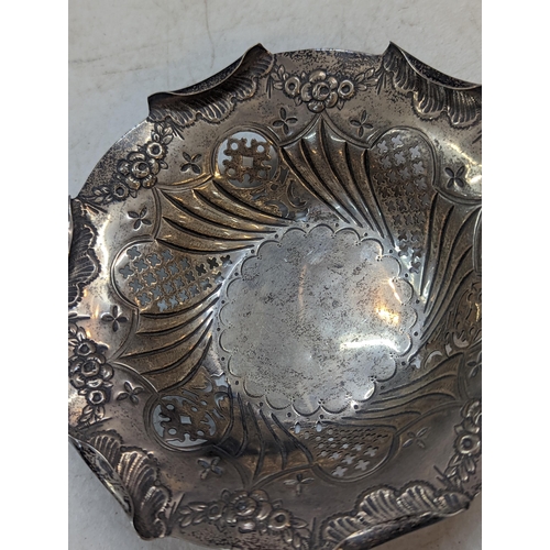 173 - A late 19th century silver dish having pierced and embossed decoration, hallmarked Birmingham 1893, ... 