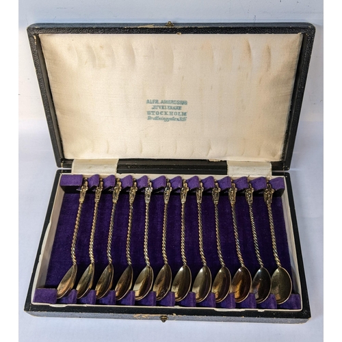 199 - A cased set of twelve Swedish white metal apostle coffee spoons, 108.3g
Location: 5.3