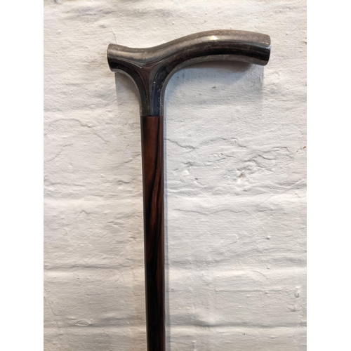 211 - A coromandel walking stick with a silver topped handle
Location: RAF