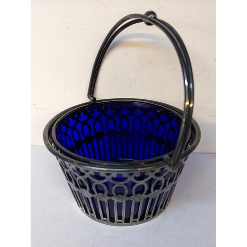 212 - An early 20th century pierced silver basket with handle, 74.5 excluding liner
Location: 4.1