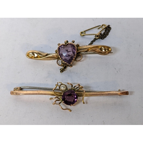 218 - Two 9ct brooches to include one decorated with a spider inset with an amethyst and seed pearls, 4.3g... 