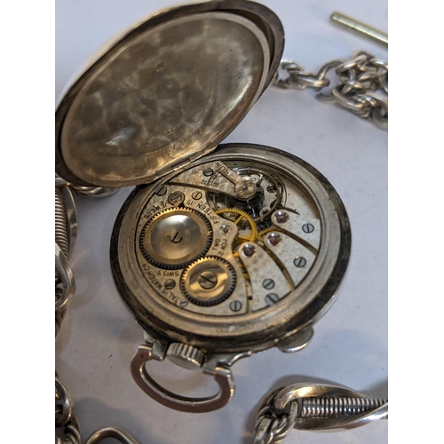 223 - An early 20th century silver fob watch by Talis Watch Co, the front decorated with a golfer, 54.3g, ... 