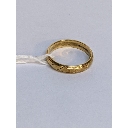 4 - A 18ct gold wedding ring with engraved ornaments, 3.8g
Location: RING