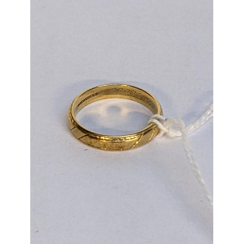 4 - A 18ct gold wedding ring with engraved ornaments, 3.8g
Location: RING