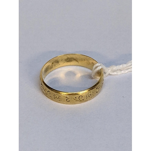 5 - A 18ct gold wedding ring with engraved ornaments, 3.8g
Location: RING