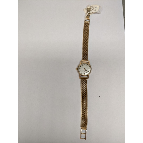 53 - An Omega 9ct gold ladies manual wind watch on a 9ct gold bracelet, 20.5g Location: CAB1