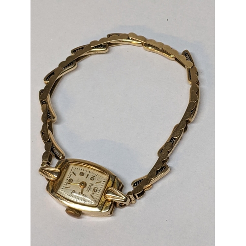 53 - An Omega 9ct gold ladies manual wind watch on a 9ct gold bracelet, 20.5g Location: CAB1