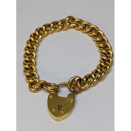 56 - A 15ct gold bracelet with heart shaped locket, 18.9g
Location: CAB1