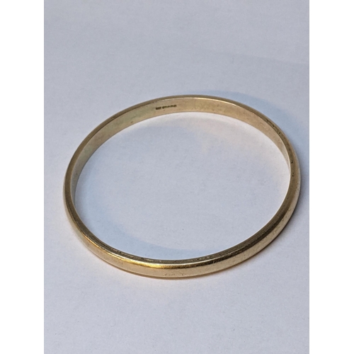 60 - A 9ct gold bangle, 34.2g Location: CAB5