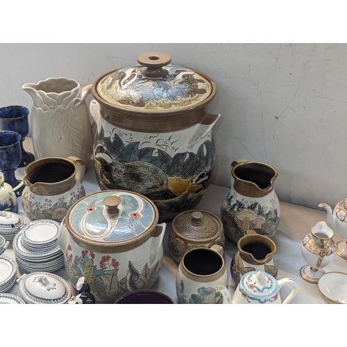 73 - A mixed lot of ceramics to include a Clarice Cliff white moulded chestnut pattern jug, M& J Mosse li... 