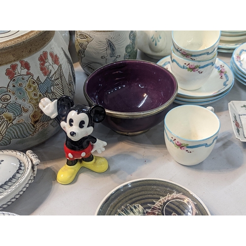 73 - A mixed lot of ceramics to include a Clarice Cliff white moulded chestnut pattern jug, M& J Mosse li... 