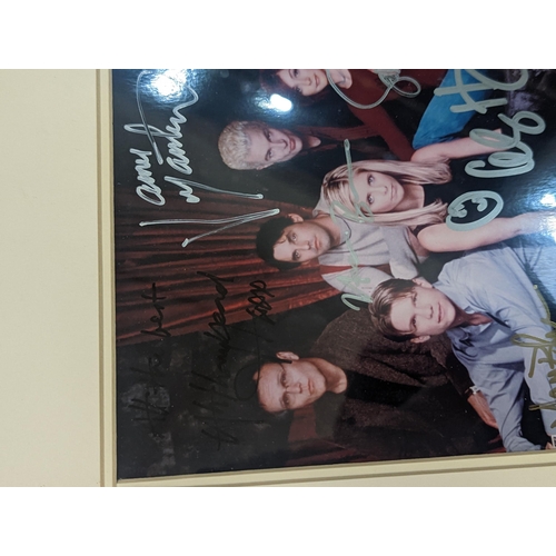 86 - A framed and glazed Buffy the Vampire Slayer photograph  singed by the cast to include Sarah Michell... 