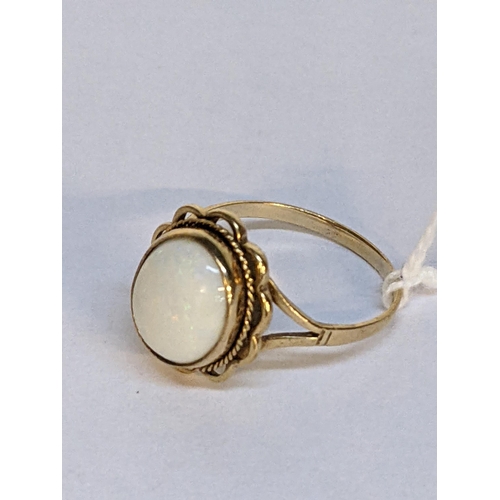 9 - A 9ct gold ring set with an opal, 3g
Location: RING